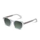 Clear frame sunglasses with green lenses on a white background