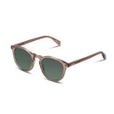 Sunglasses with champagne colored frame and dark lenses on a white background