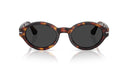 Sunglasses with tortoise frame and dark lenses on a white background