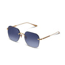 Gold sunglasses with blue gradient lenses on a white background