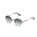 Rimless sunglasses with gold frame and green gradient lenses on a white background