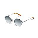 Silver rimless  sunglasses with dark lenses on a white background