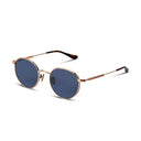Round sunglasses with rose gold frame and blue lenses on a white background