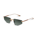 Sunglasses with gold frame and dark lenses on a white background
