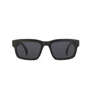 Black sunglasses with dark lenses on a white background