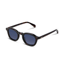 Sunglasses with dark lenses and tortoiseshell frame on a white background