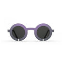 Blackfin Sunglasses with round purple frames and dark lenses 
