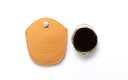 Clip on with its tan leather protective cover on a white background. 