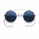 Round metal-framed sunglasses with dark blue lenses, featuring a double bridge and thin wire temples, shown on a plain white background.