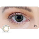 Close-up of an eye wearing gray contact lenses with a contact lens inset.