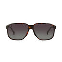 A pair of square sunglasses with a dark brown and amber tortoiseshell frame and dark gray gradient lenses, shown against a plain white background.