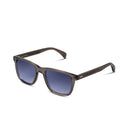 Grey sunglasses with dark gradient blue lenses on a white background