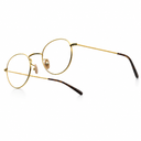 Side angle of gold framed round eyeglasses on a white background. 