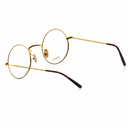 Side angle of gold framed round eyeglasses on a white background. 