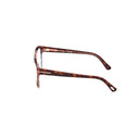 Side angle of havana-framed eyeglasses on a white background