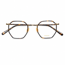 Eyeglasses with a tortoiseshell acetate frame and gold metal double bridge, shown on a plain white background.