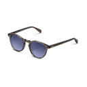 Round sunglasses with a translucent dark grey acetate frame and blue gradient lenses, shown on a clean white background.