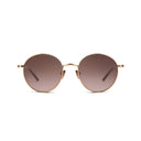 Front angle of rose gold sunglasses with dark lenses on a whte background. 