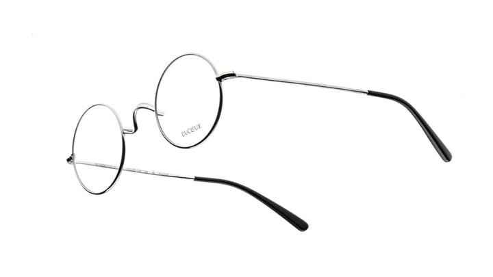 Ducloux Round eyeglasses with thin silver frames on a white background