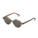 Champagne colored oval sunglasses on a white background