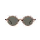 Oval sunglasses with translucent champagne colored frames and dark green lenses, shown against a plain white background.