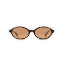 Oval sunglasses with a black and yellow tortoiseshell frame and warm brown lenses, shown against a plain white background.