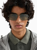 Guy wearing double bridge sunglasses on a white background. 