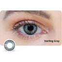 Close-up of an eye wearing Sterling Gray contact lenses with a lens displayed below.