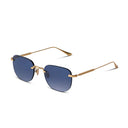 Sunglasses with gold frame and dark blue lenses on a white background
