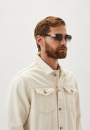Side angle of a guy wearing sunglasses on a white background.